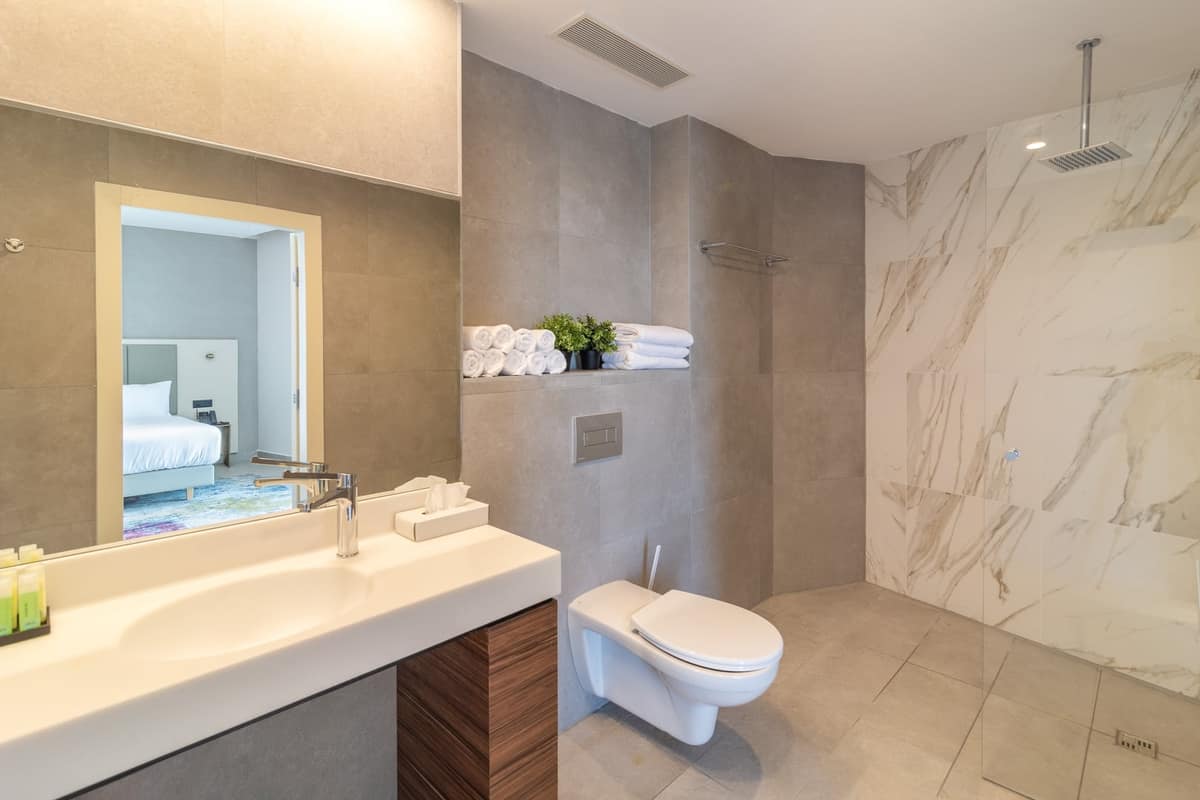Marble en-suite bathroom with soaking tub at Hotel Yirmiyahu 33, Romema, Jerusalem