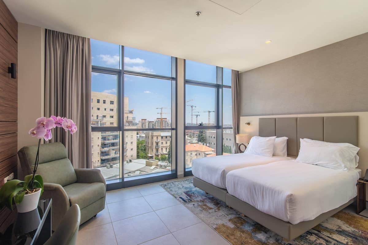 Deluxe guest room with private balcony overlooking Jerusalem at Hotel Yirmiyahu 33, Romema